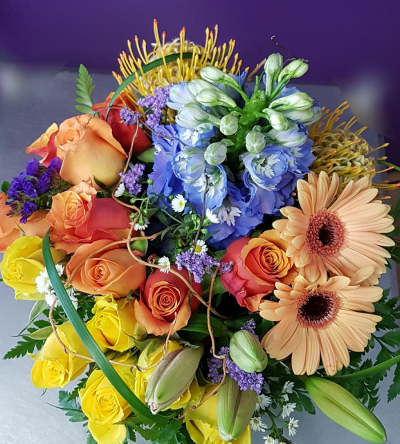 Colour Me Bright - A seasonal mix of bright flowers which may vary slightly depending on availability and seasonal changes but always bright, fresh and vibrant