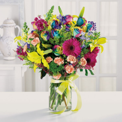 Four Seasons - A seasonal variety of mixed flowers to suit any season and therefore suitable for all occasions. Prepared and delivered in a glass vase which is finished off with a swirl of ribbon in keeping with the occasion